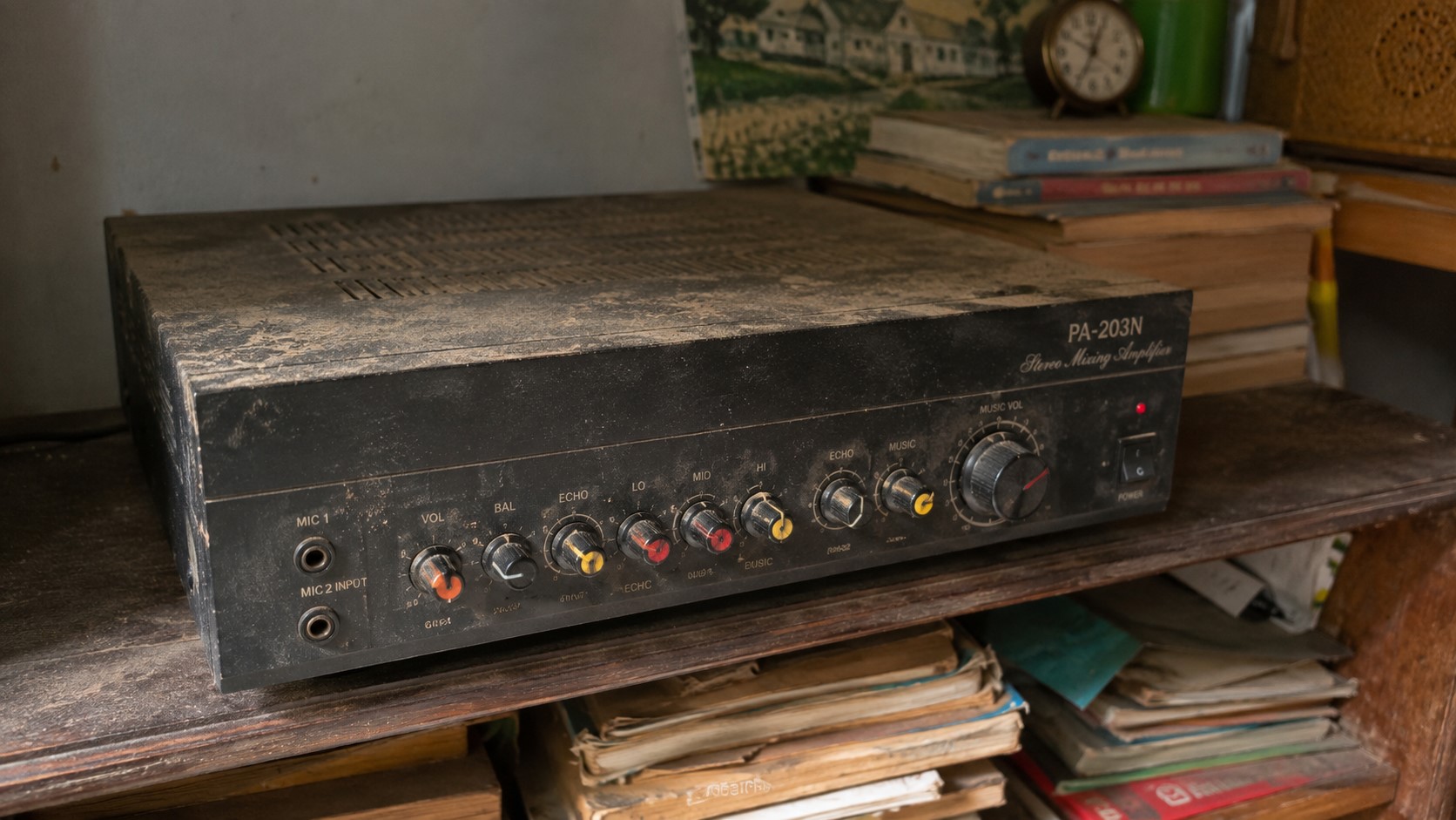 Dusty Stereo Amplifier on a Wooden Shelf